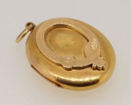 A Victorian 18 carat gold oval locket, 17g, 3.7 x 3cm