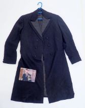 A black frock coat worn by David Warner for the film The Thirty Nine Steps