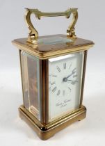 A Charles Frodsham brass carriage clock with key, 11cm tall