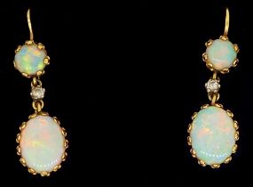A pair of 18 carat gold pendant earrings set opals and small diamonds