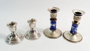 A pair of silver squat candlesticks, London 1983, 7cm tall and pair of blue and white china and