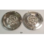 A pair of Arts & Crafts silver embossed Tudor Rose dishes, London 1899 by Child & Child, 151g,