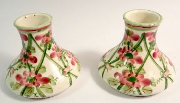A pair of Faience floral trellis vases, 9cm