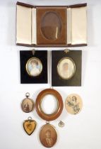 A box of various antique miniatures and frames