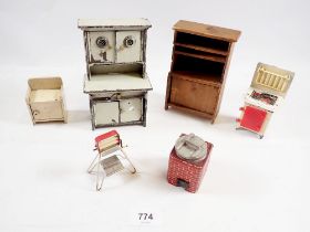 A group of vintage kitchen dolls house furniture including wood dresser, enamel larder cabinet,