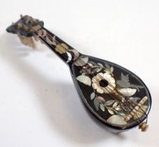 A miniature tortoiseshell and mother of pearl miniature mandolin with bird and flower inlay and bone