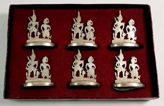 A boxed set of six Malayan silver menu stands 5cm tall