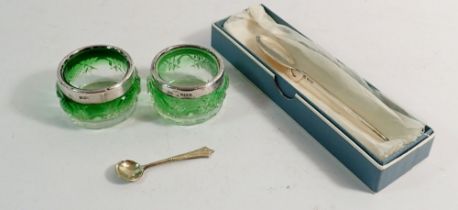 Two green glass salts with silver rims and a silver jam spoon, boxed