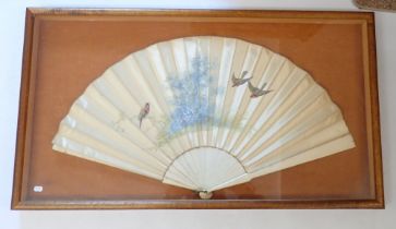 A 19th century silk fan painted birds and trees on bone sticks, framed and glazed 74 x 42cm