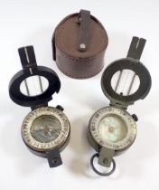 Two military WWII compasses - one by Stanley with mother of pearl dial and one with broadarrow