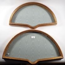 A pair of gilt fan frames, 58cm and 53cm wide