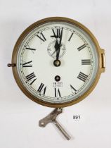 A brass Smiths Astral ships clock with key, 18.5cm diameter