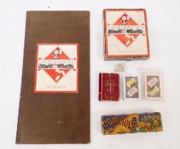 A group of old games including 1930's dominoes and Lexicon and 1940's Monopoly and board and two