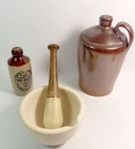 A pestle and mortar, stoneware flagon, 26cm tall and Stacey's drinks bottle