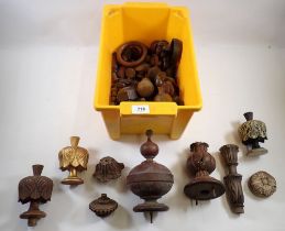 A box of carved treen door knobs, finials etc.