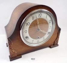 An oak chiming mantel clock, 25.5cm wide