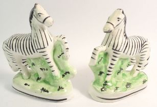 A pair of Victorian Staffordshire zebra, 16cm tall