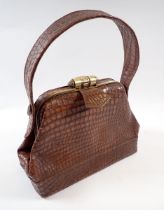 A vintage fake snakeskin handbag