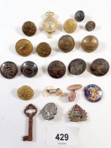 A box of military buttons, badges etc.