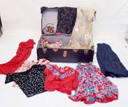 A trunk of ladies designer clothes including Frank Usher red dress, navy skirt and sequin top plus a