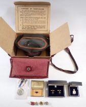 A gas mask - boxed and various military enamel badges including YWCA