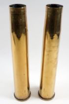 A pair of brass shell case vases, 31cm