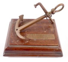 A copper commemorative anchor on mahogany plinth with dedication to 'HMS Eurydice, foundered 1878'