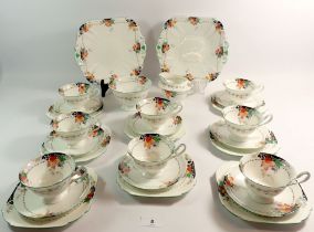 A Shelley vintage tea service decorated fruit comprising eight cups (3 a/f), ten saucers, milk,