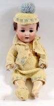 A bisque headed composition doll with cry voice box - a/f, eyes loose, open mouth with teeth and red