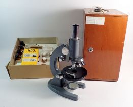 A Chinese Model L-101 microscope with box of slides and solutions, -boxed, 37cm tall