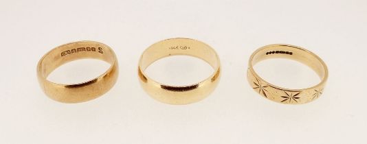 Two 9 carat gold wedding bands, 6.6g and a 14k one, 4.9g, sizes P, Q & T