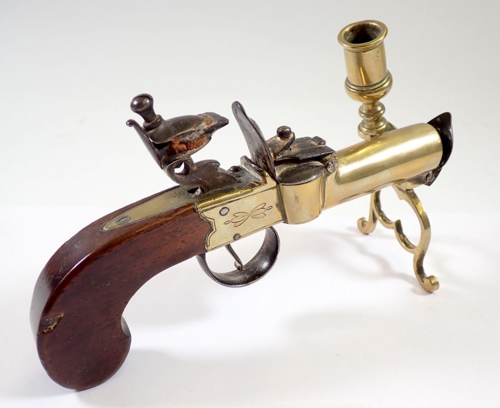 An antique percussion action pistol table lighter with taper stick, 17cm long and a brass stirrup - Image 3 of 3