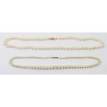 Two single string pearl necklaces with 9 carat gold clasps