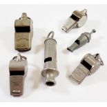 Six various whistles including Acme