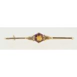 An 18 carat gold bar brooch set orange topaz, 1.6g, boxed