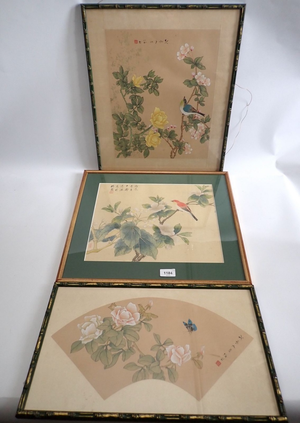 Two Chinese silk prints of birds and flowers and a similar fan form one, largest 37 x 30cm