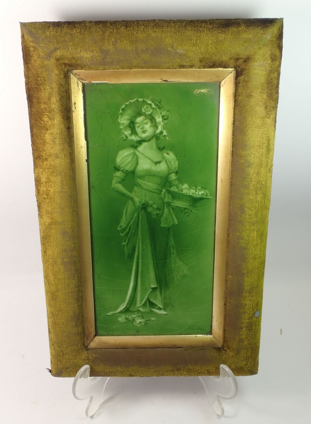 A Sherwin and Cotton green glazed tile printed lady with basket of roses, 29 x 14cm