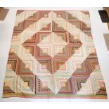 A vintage large patchwork quilt 218 x 187cm