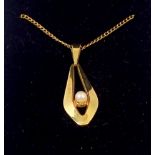 A 9 carat gold pendant set pearl, boxed, 1.9g