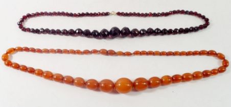 Two amber necklaces, 65cm and 62cm long