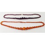 Two amber necklaces, 65cm and 62cm long