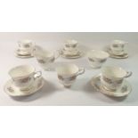 A Royal Kent floral printed vintage tea service comprising six cups and five saucers, three tea