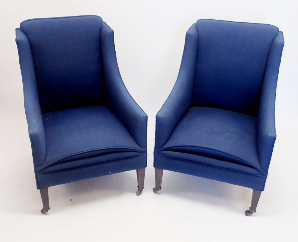 A pair of small Edwardian blue upholstered small tub chairs on square