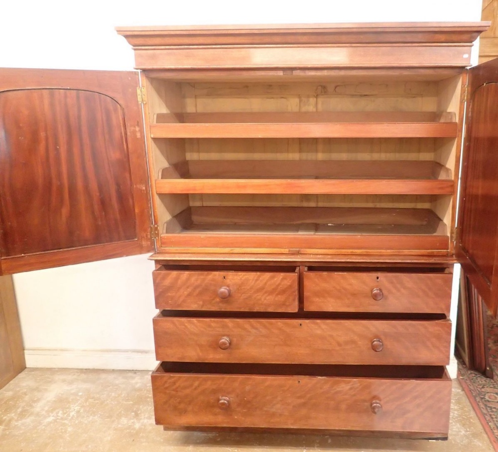 A 19th century mahogany small linen press with two arch panelled doors enclosing trays all over - Image 3 of 3