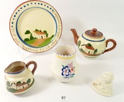 A Doulton Buzfuz bust, a Poole vase and a Torquay Ware teapot, jug and plate