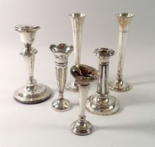 A group of silver candlesticks and spill vases (6)