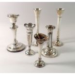 A group of silver candlesticks and spill vases (6)