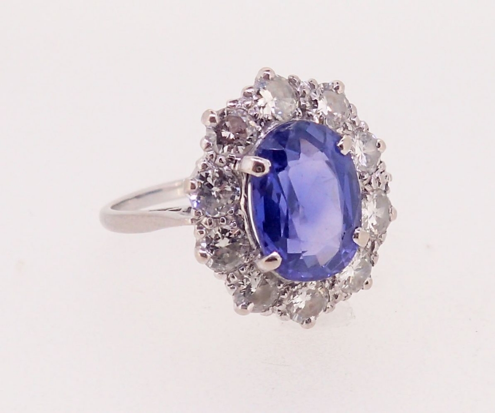 A fine Ceylon sapphire and diamond cluster ring, the sapphire 11mm x 8mm, ring size O, 4.8g - Image 4 of 7