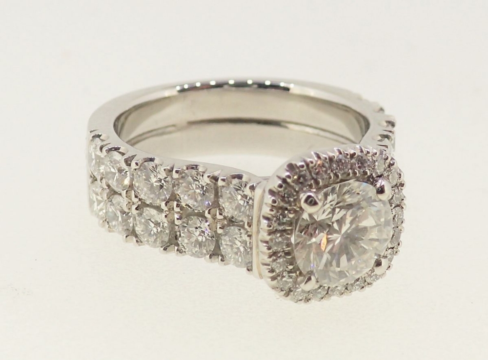 A fine modern platinum ring set brilliant cut diamond within diamond surround, the band half set - Image 5 of 6