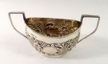 A Walker & Hall silver sugar bowl with embossed scrollwork decoration, Sheffield 1902, 8.5cm tall,